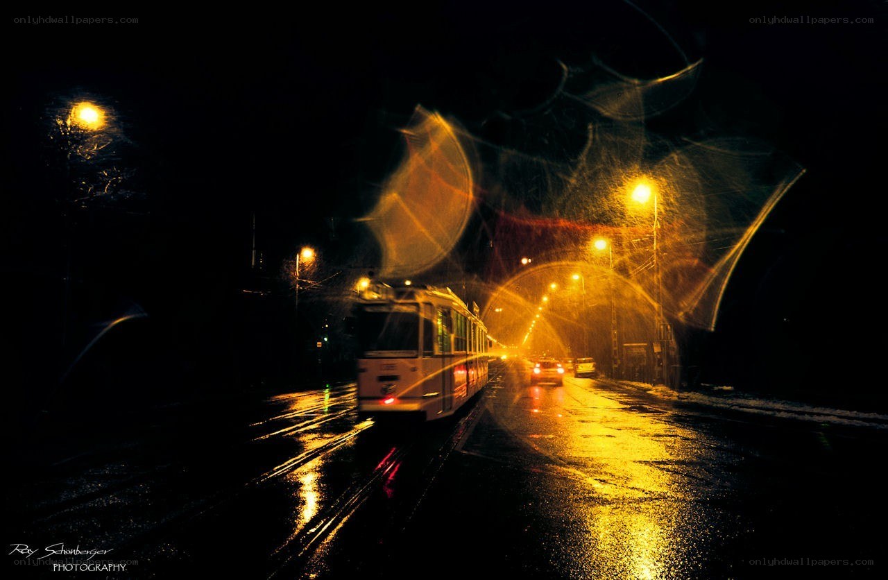 Tram at night in rain