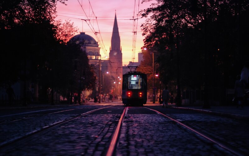 Tram on Cobblestone Street