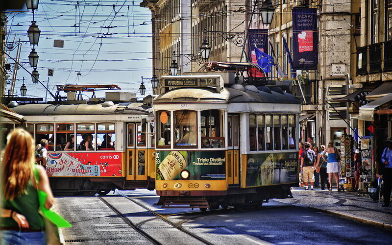 Trams on City Street — Yellow
