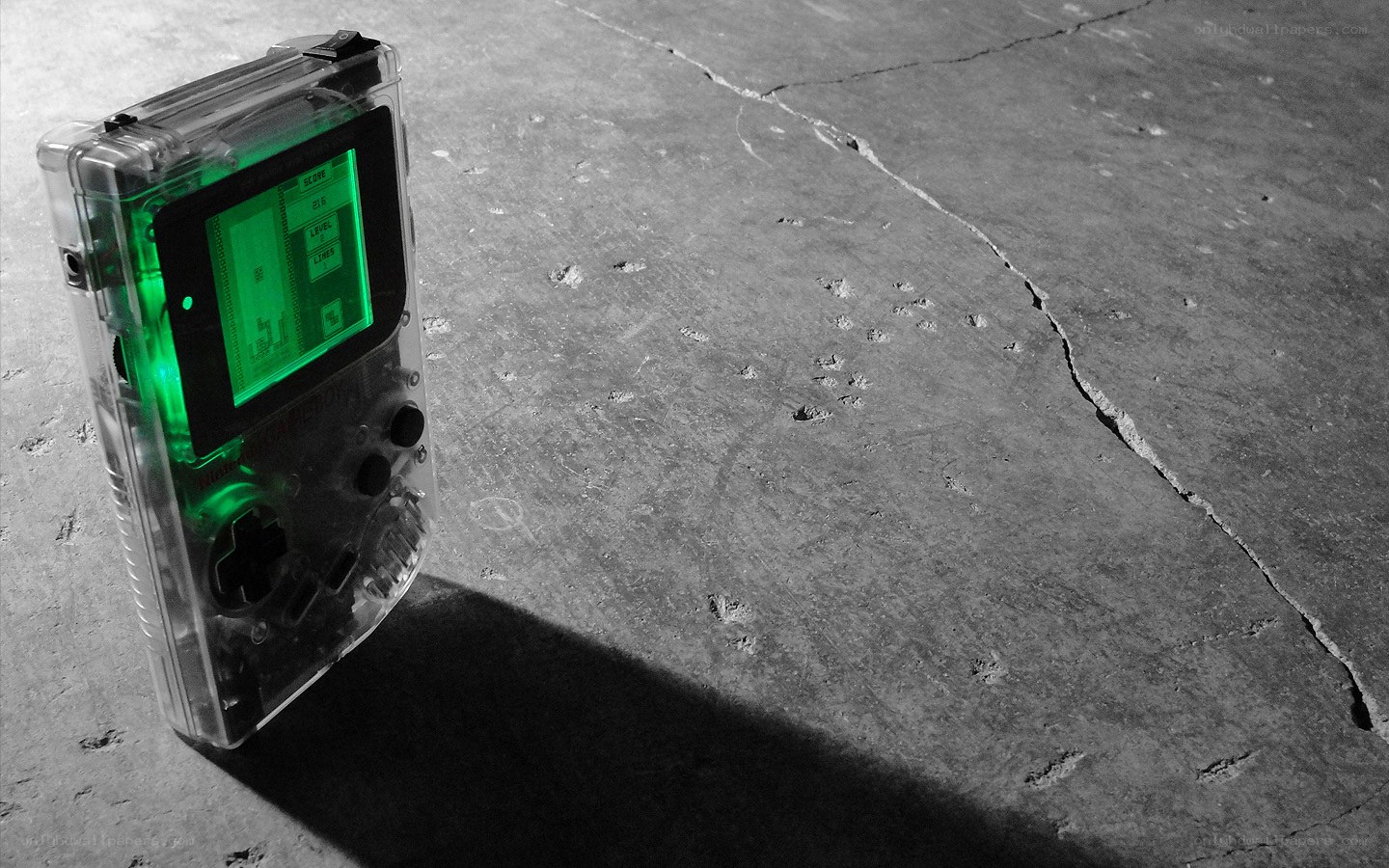 Transparent Game Boy on concrete