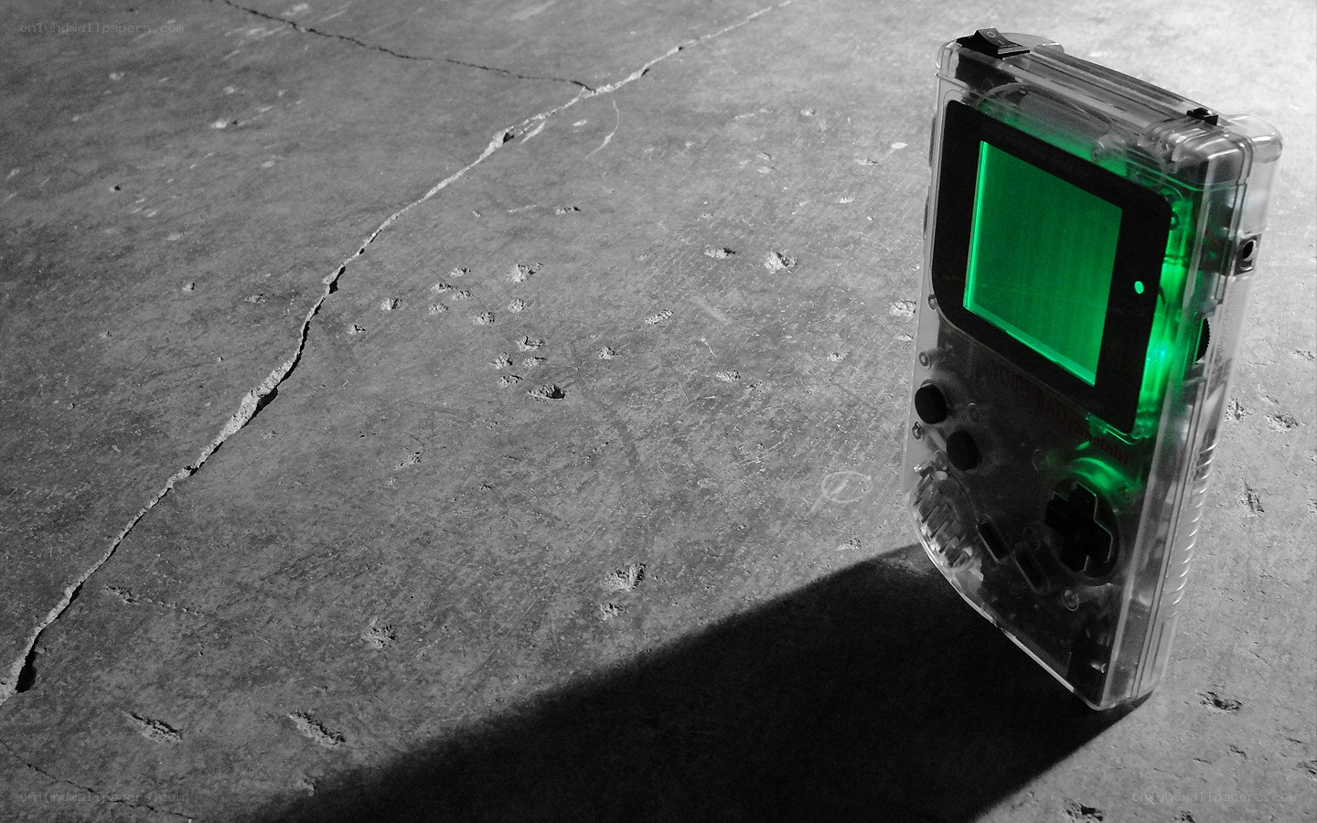 Transparent Game Boy on concrete