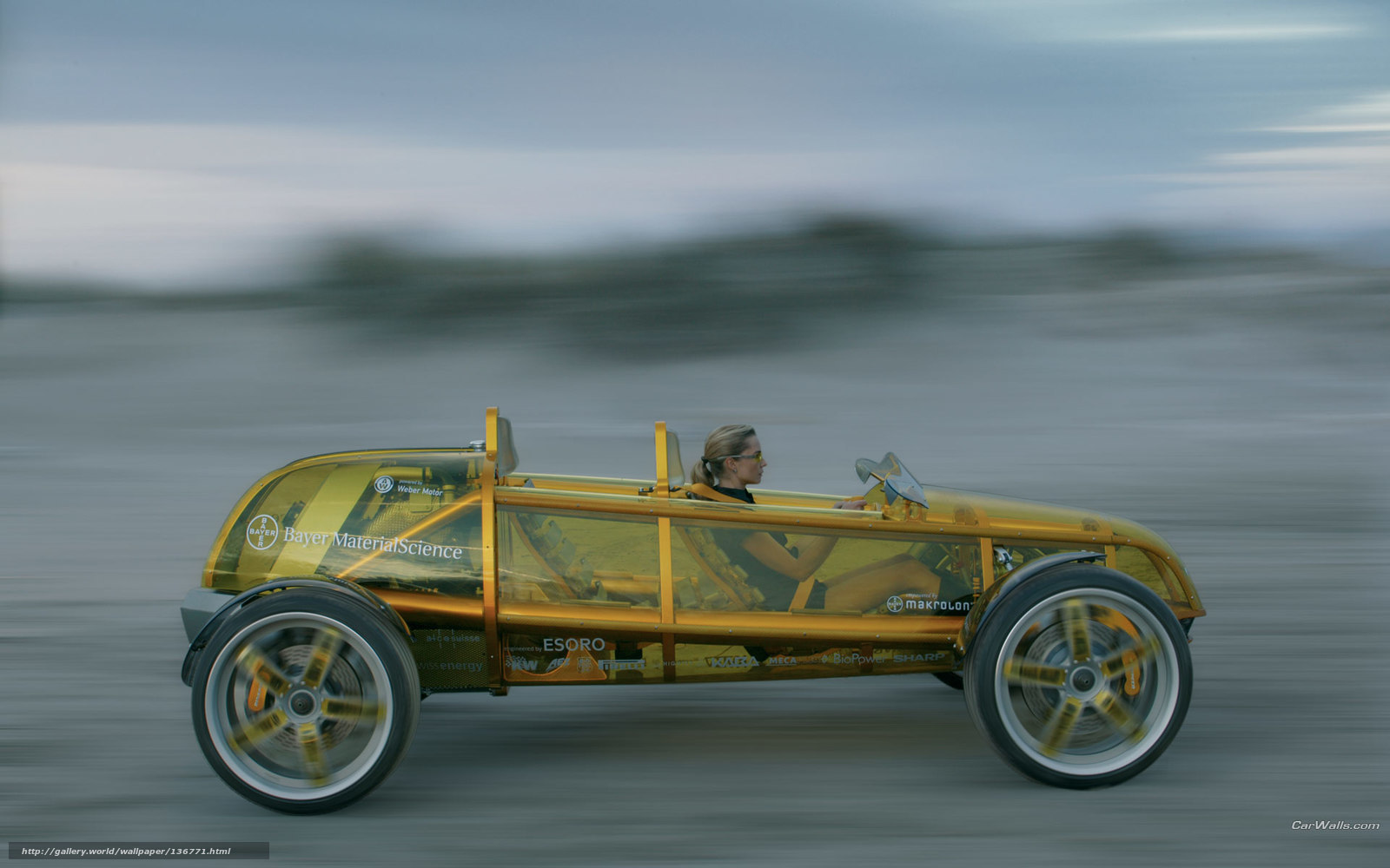 Transparent yellow concept car in motion