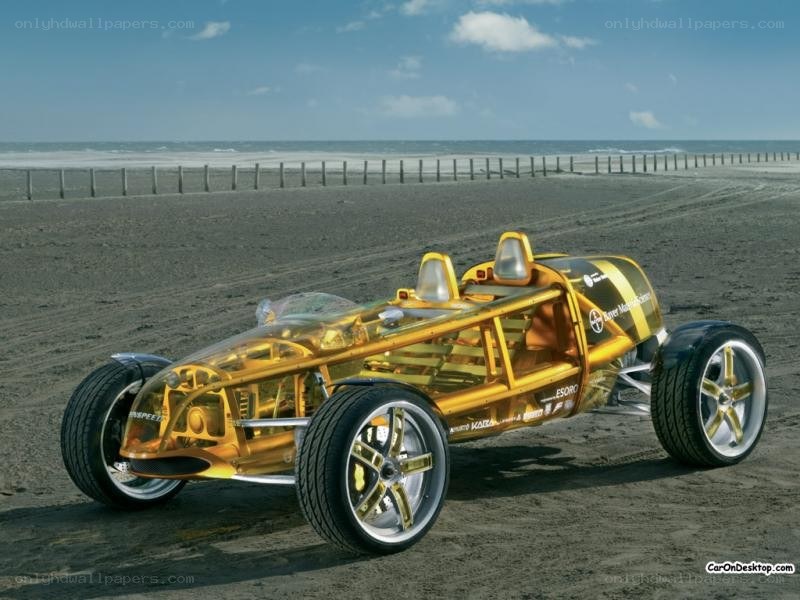 Transparent yellow race car on beach