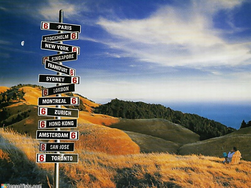 Travel signs on a hillside