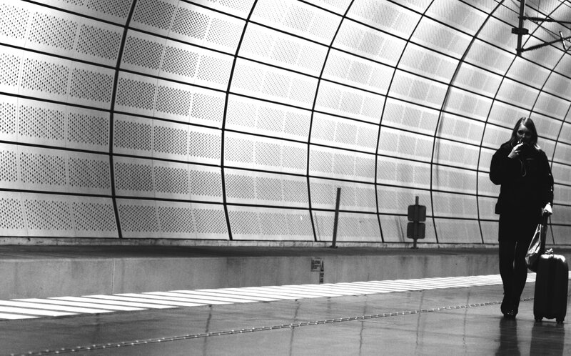 Traveler with luggage in station