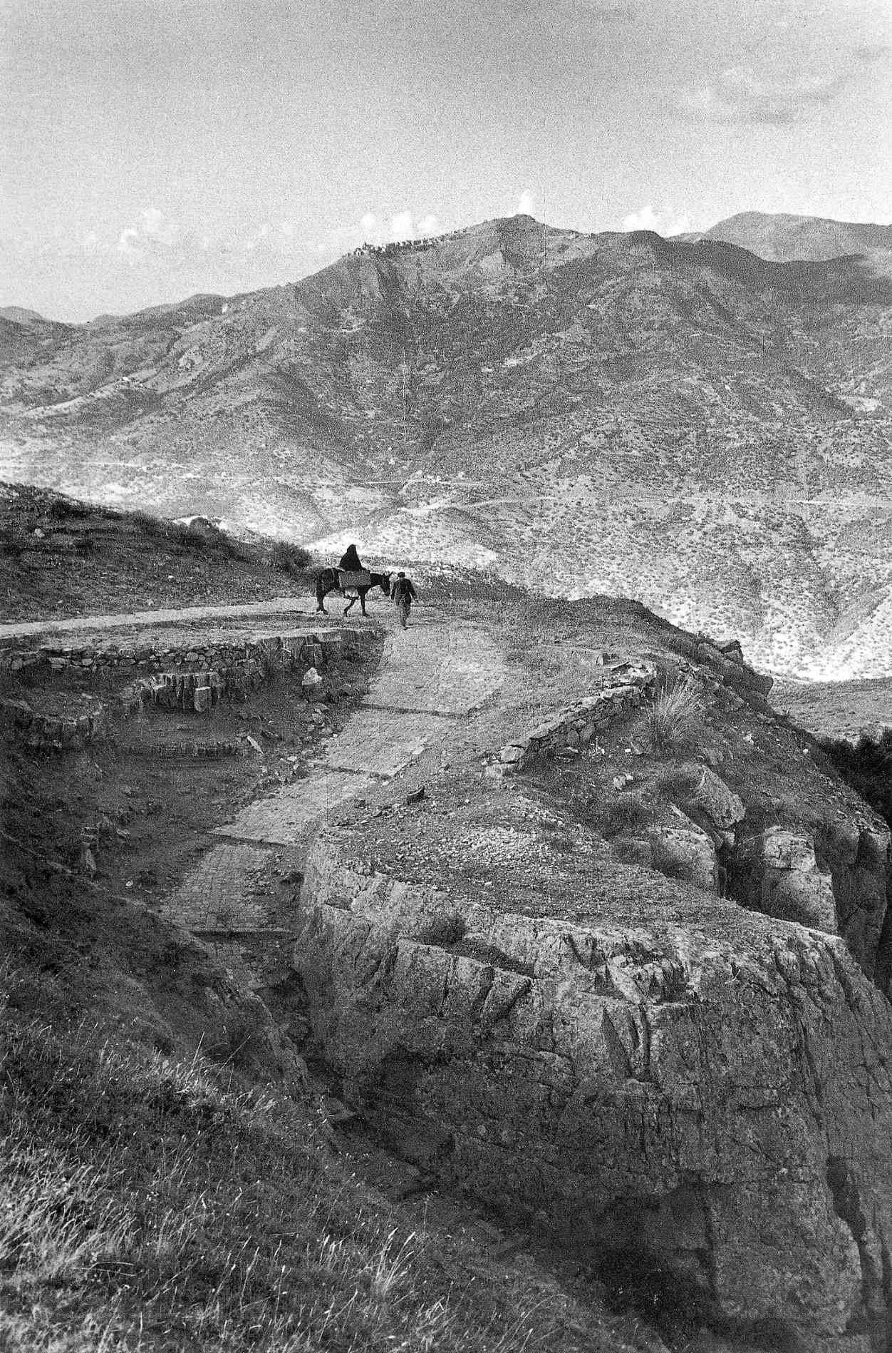 Travelers on a mountain path