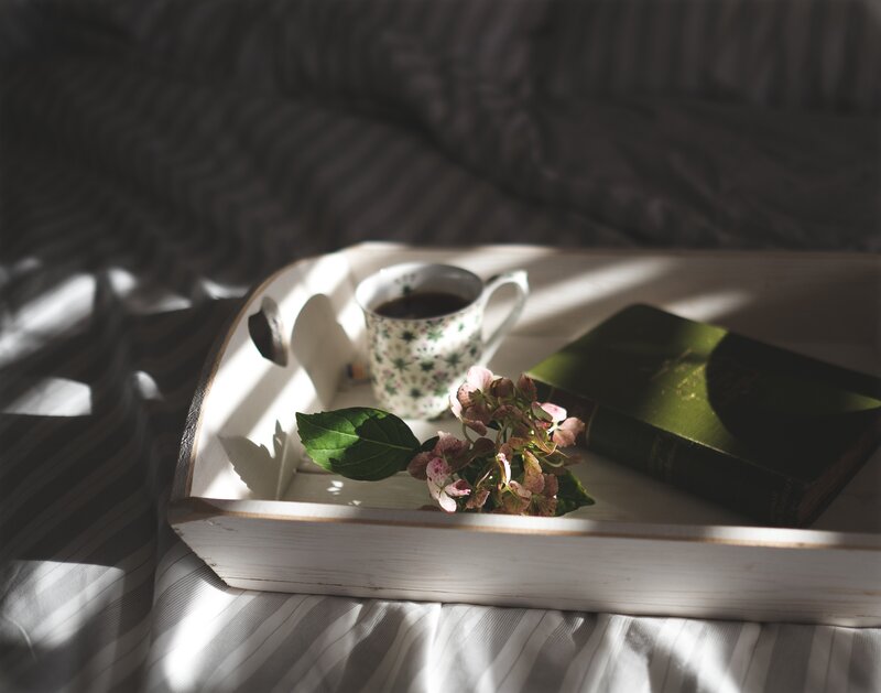Tray with tea and book