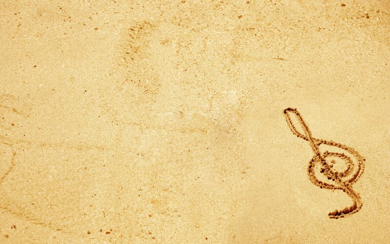 treble clef drawn in sand