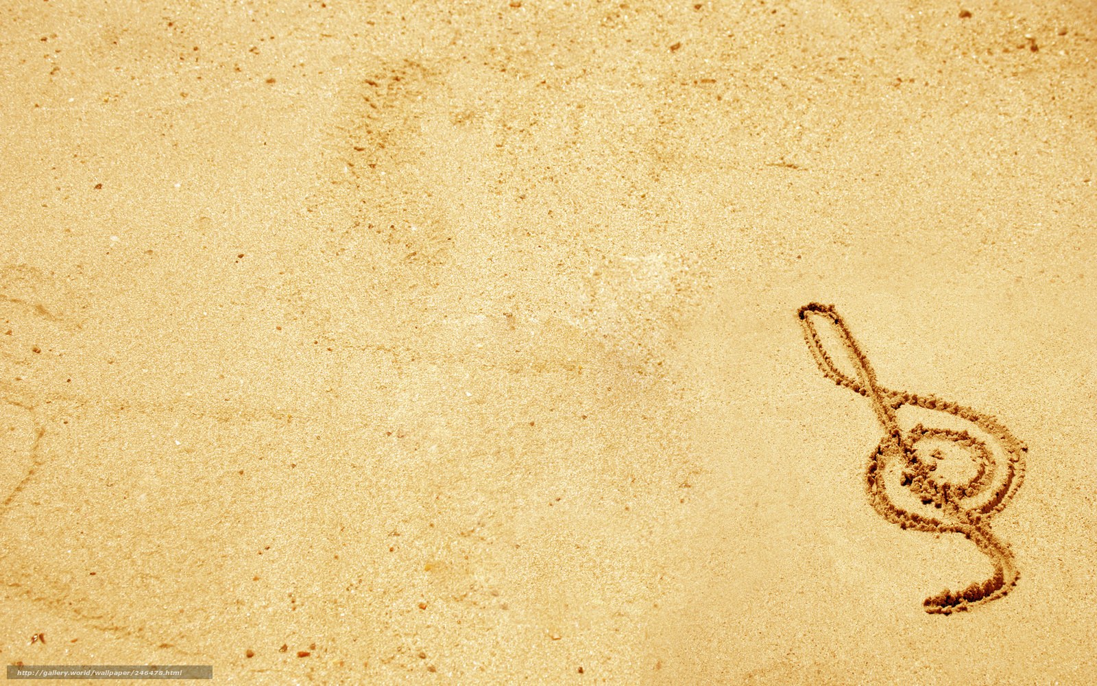 treble clef drawn in sand