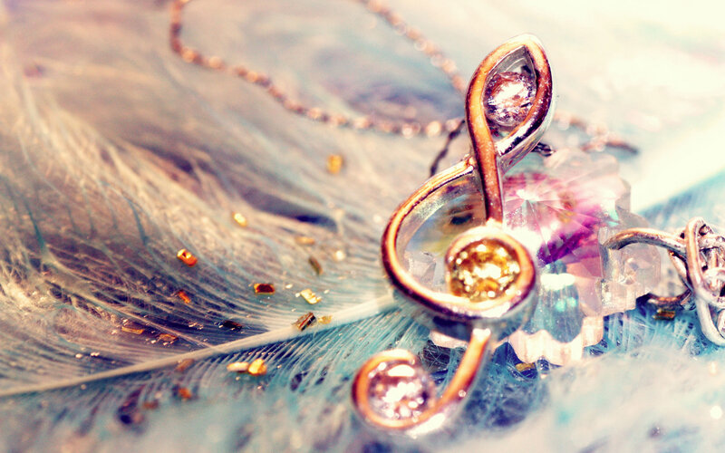 treble clef pendant on feather
