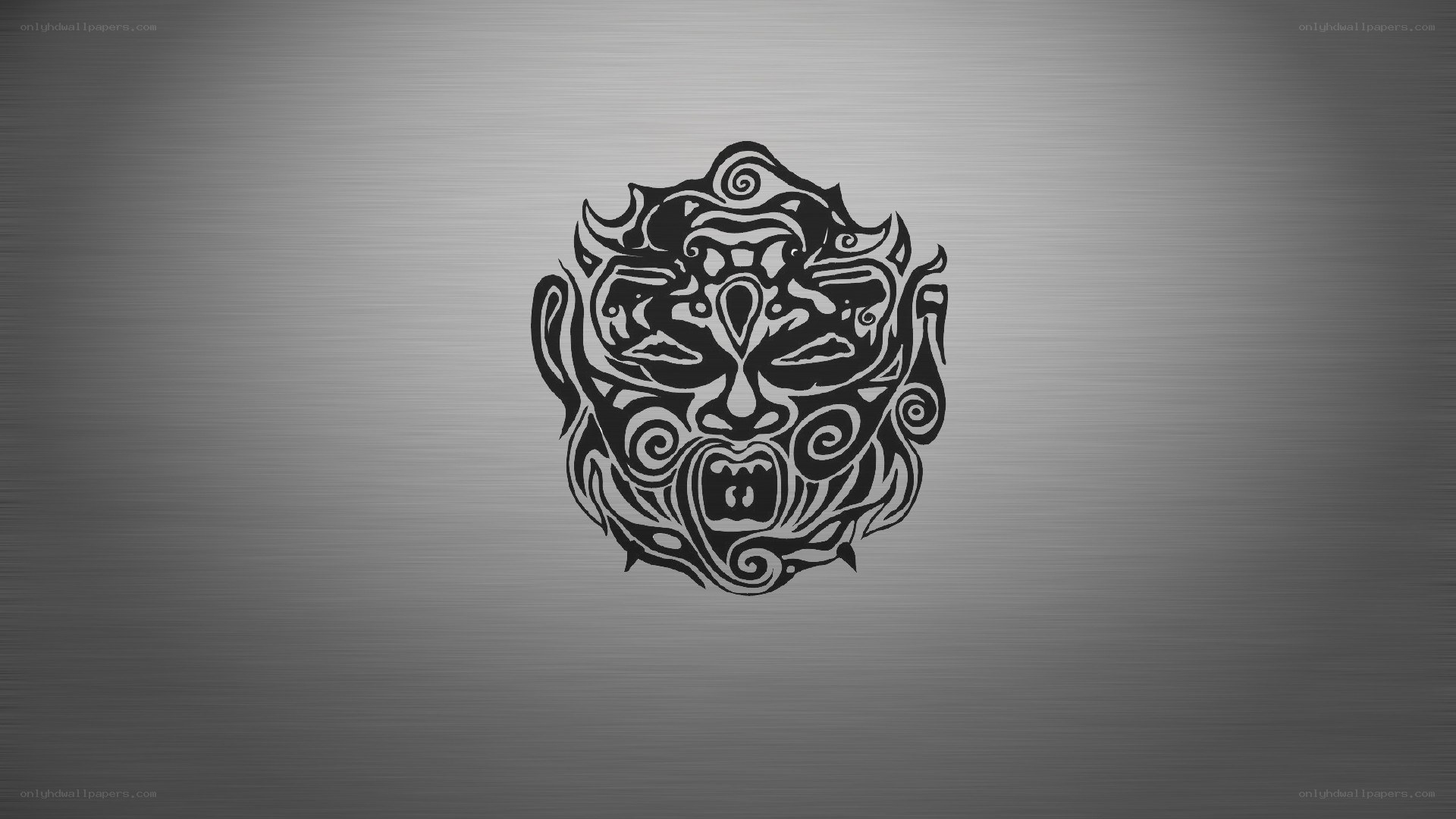 tribal mask design on metal