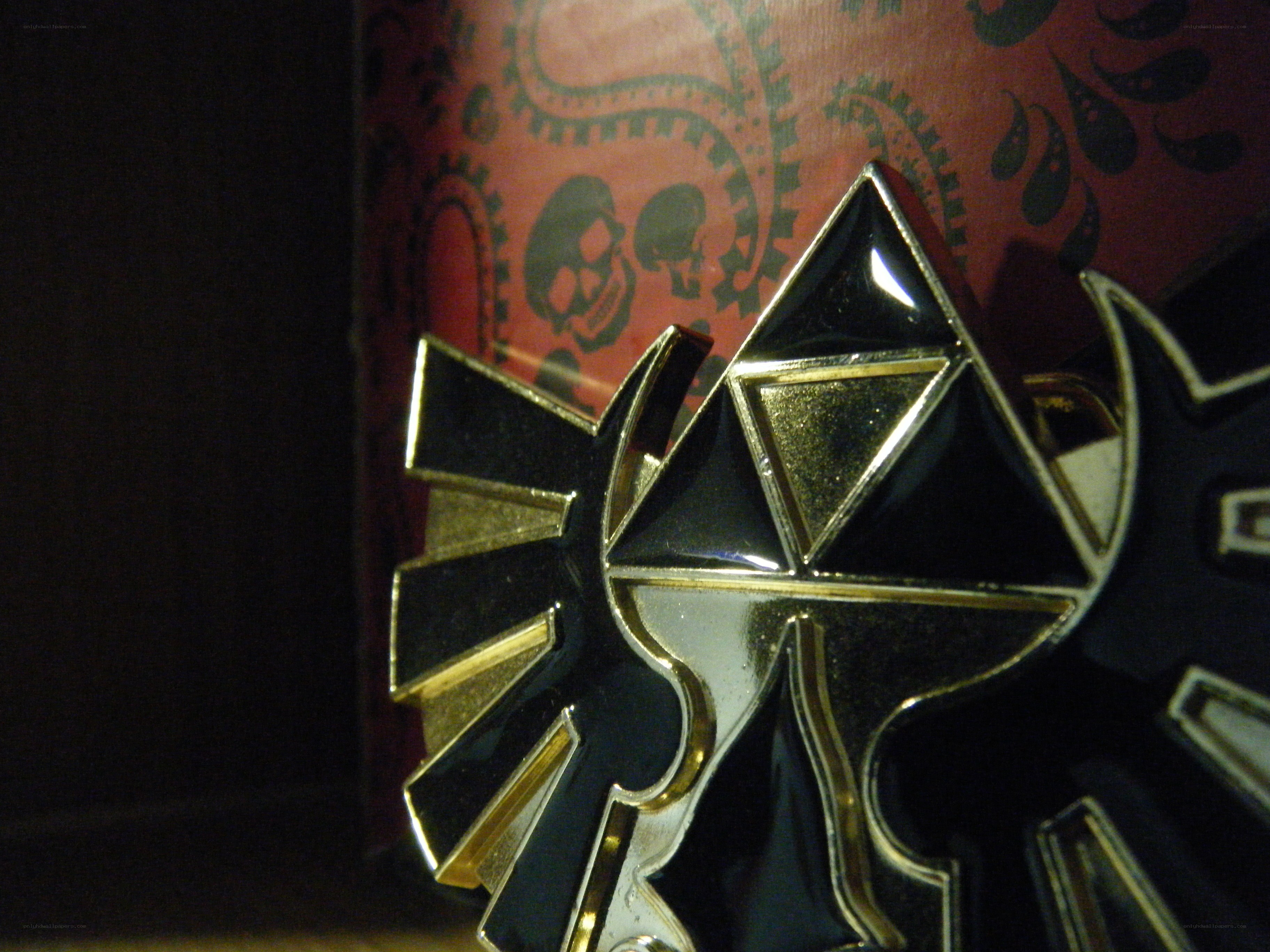 Triforce emblem on red background