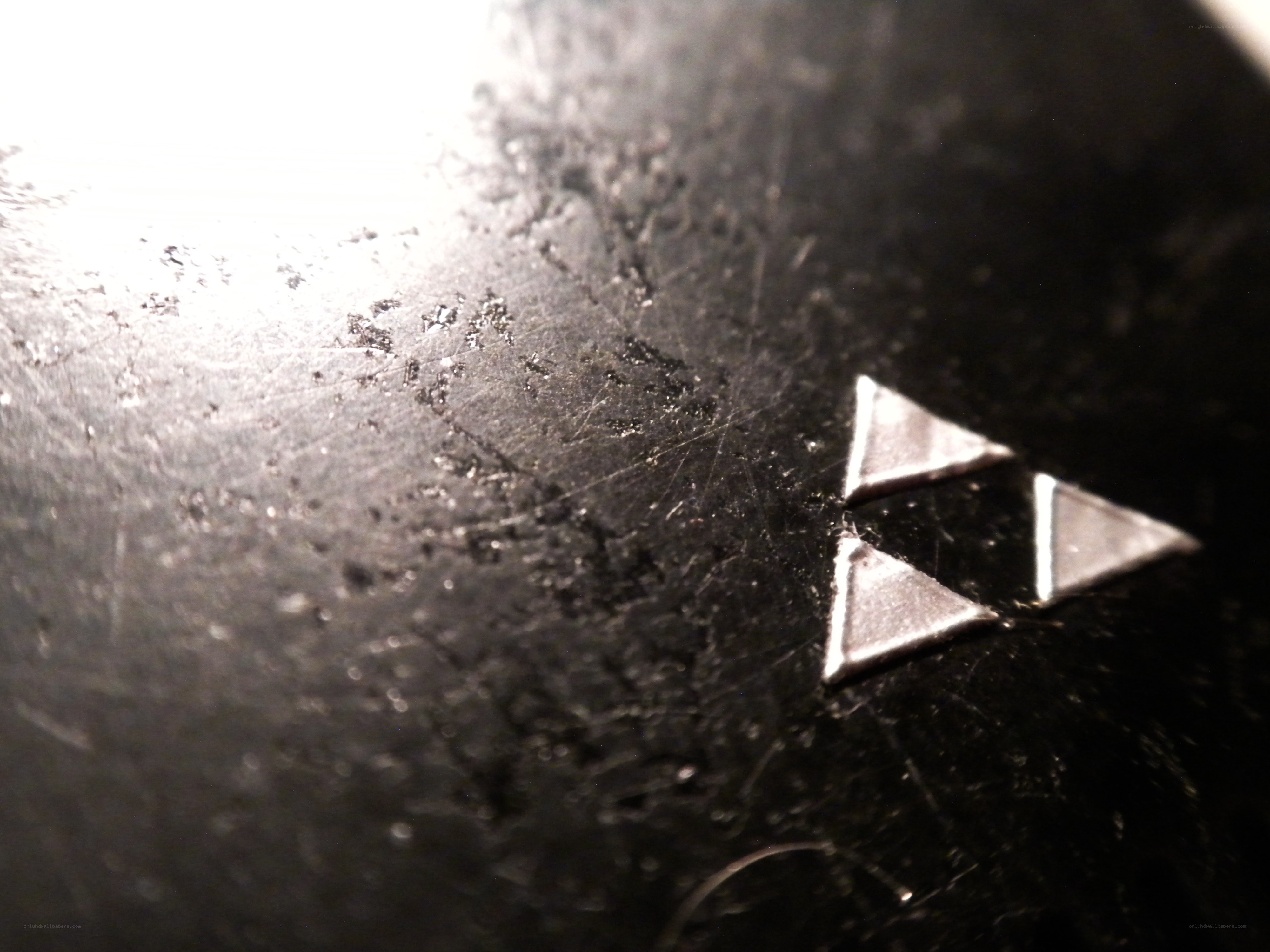 Triforce symbol on scratched surface