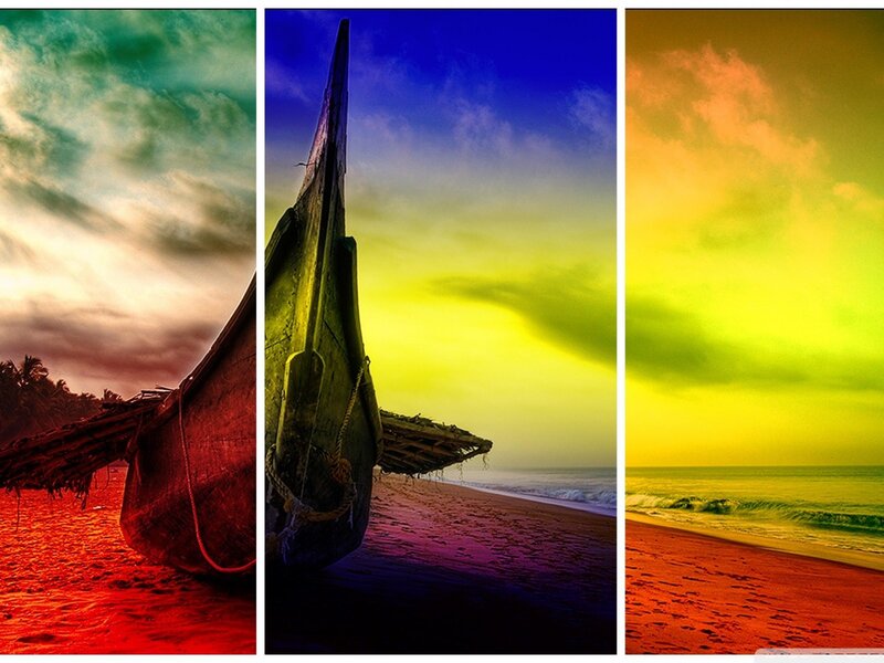 Triptych of boats on beach