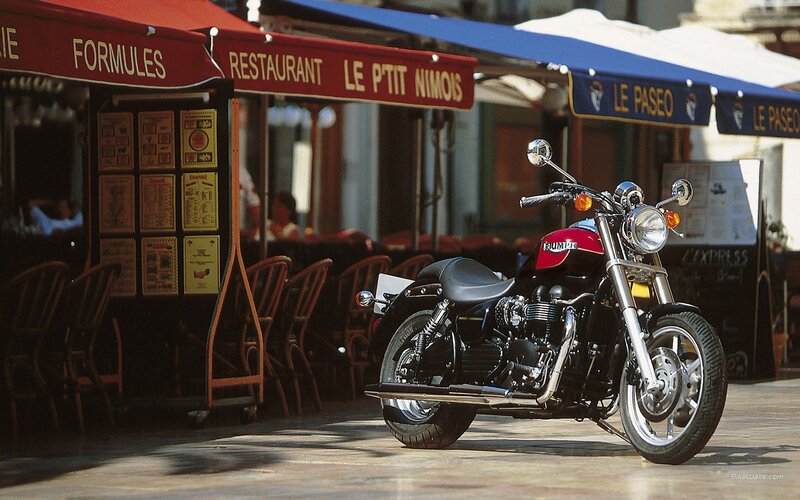 Triumph motorcycle at a French café