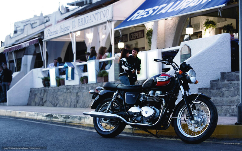 Triumph motorcycle at a seaside restaurant