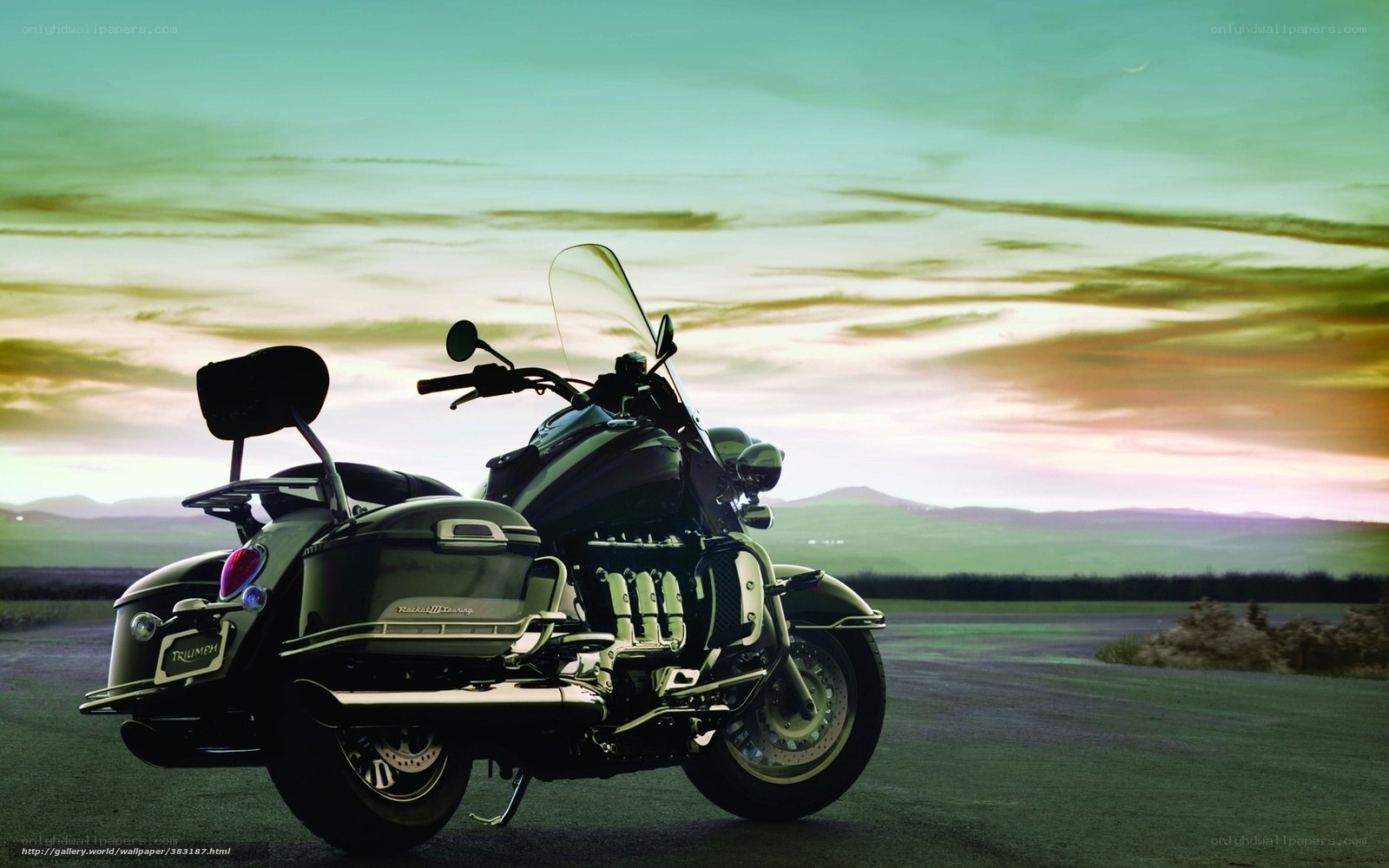 Triumph motorcycle at sunset
