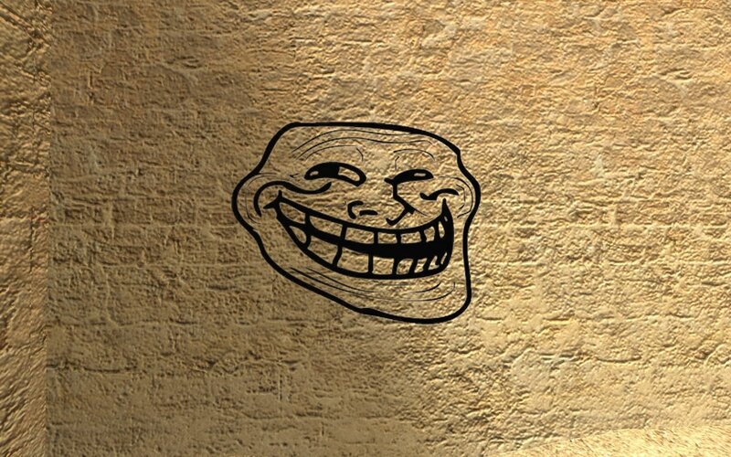 troll face meme on stone