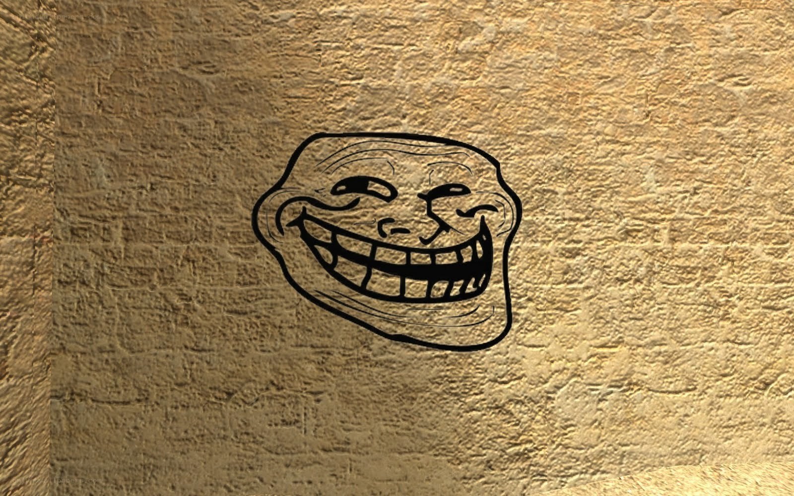 troll face meme on stone