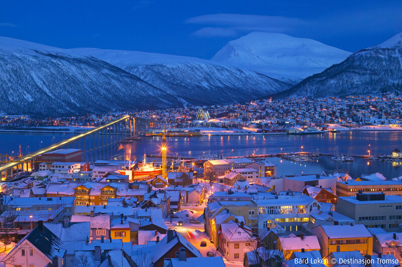 Tromsø at dusk with snow-covered mountains