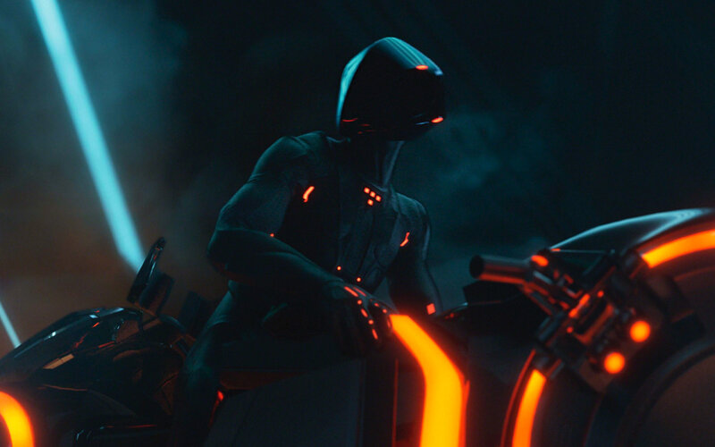 Tron character on a light cycle