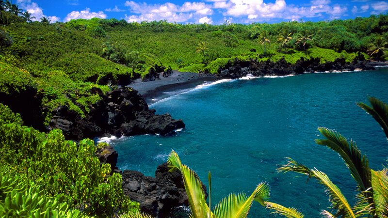 tropical bay with black sand beach
