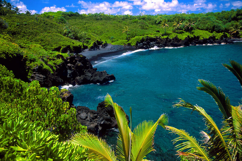 tropical bay with black sand beach