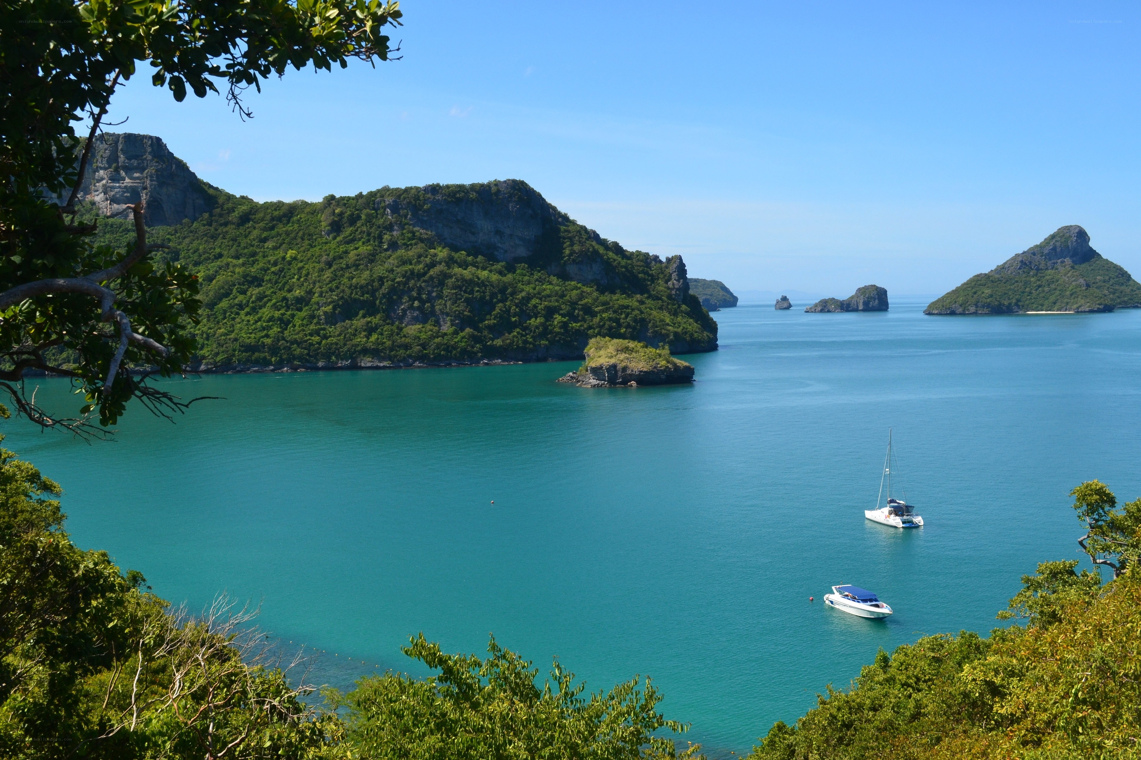 tropical bay with boats and islands