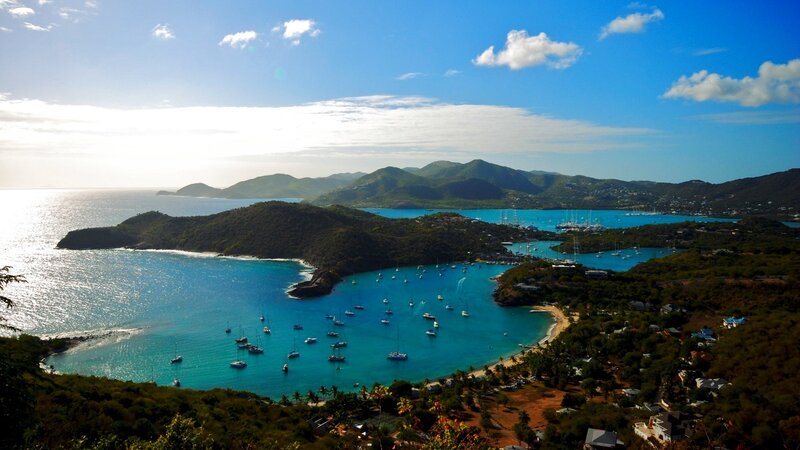 tropical bay with boats and mountains