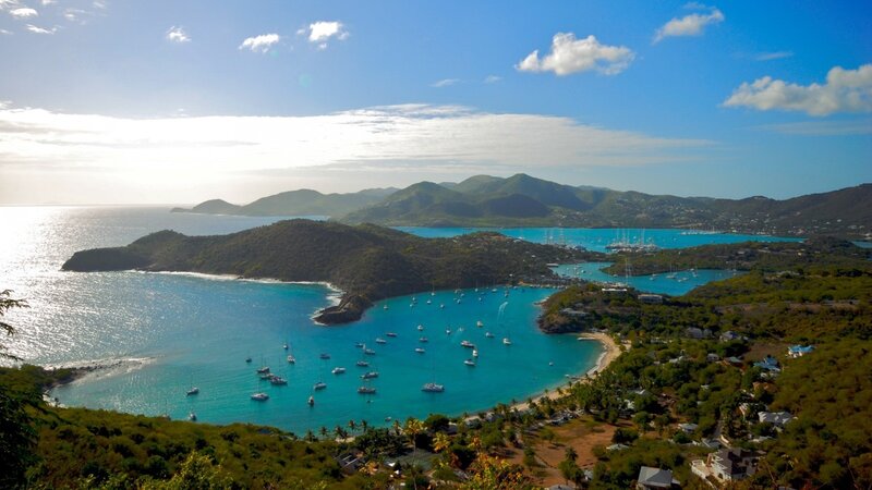 tropical bay with boats and mountains