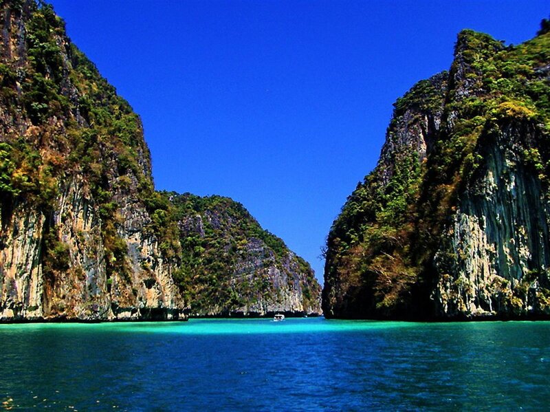 Tropical Bay with Cliffs — Blue, Serene, Afternoon, Photograph, Boat