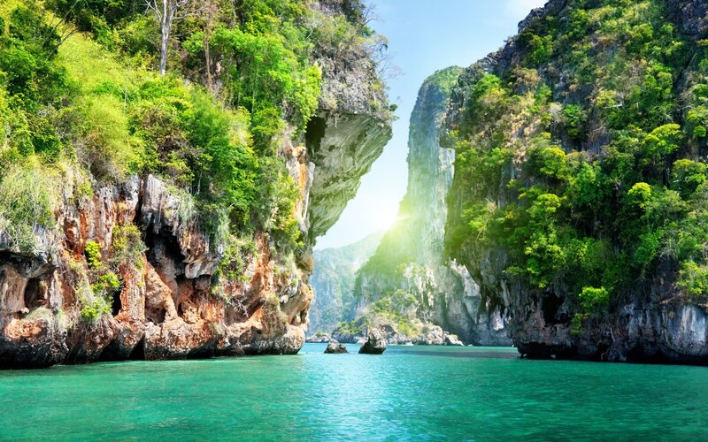 Tropical Bay with Cliffs — Green, Serene, Afternoon, Photograph, Trees, Water, Blue, Brown