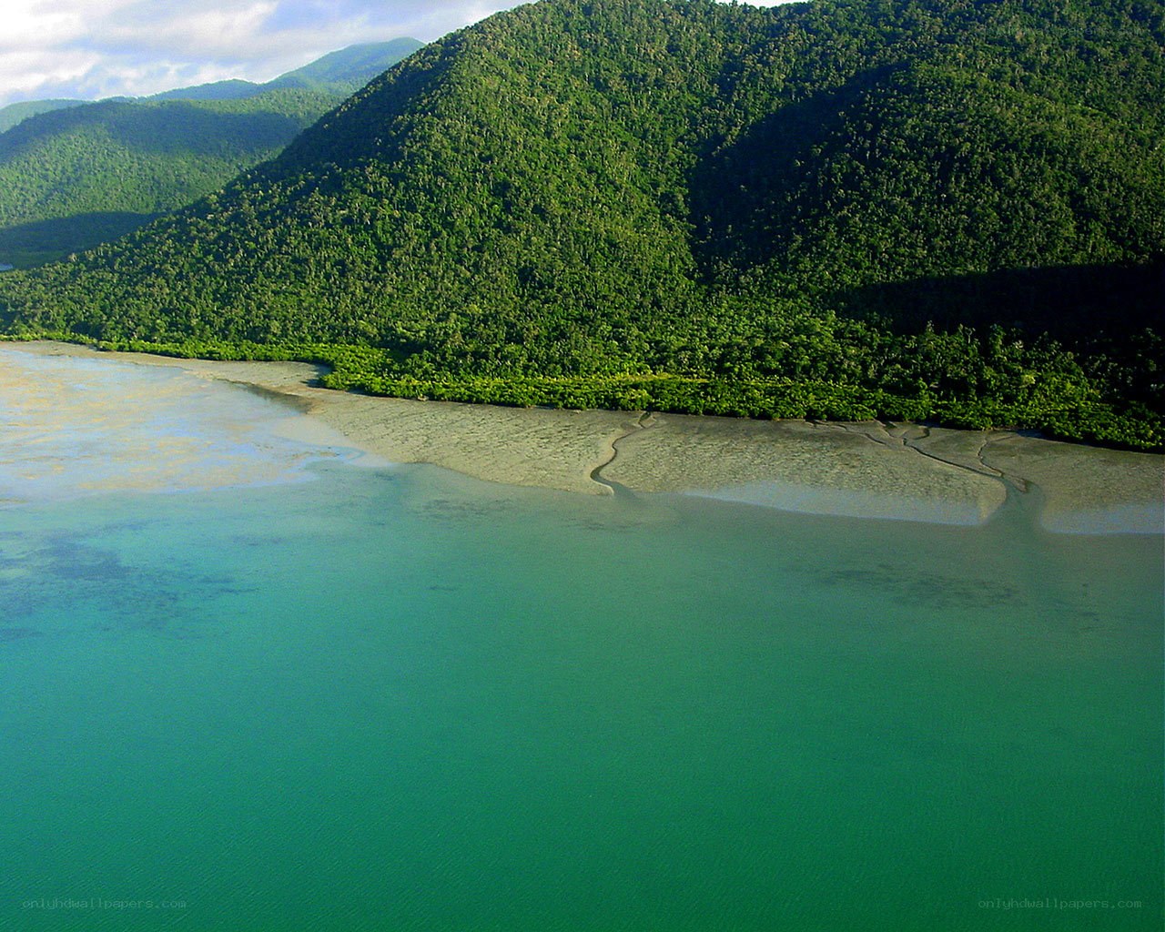 tropical bay with forested hills