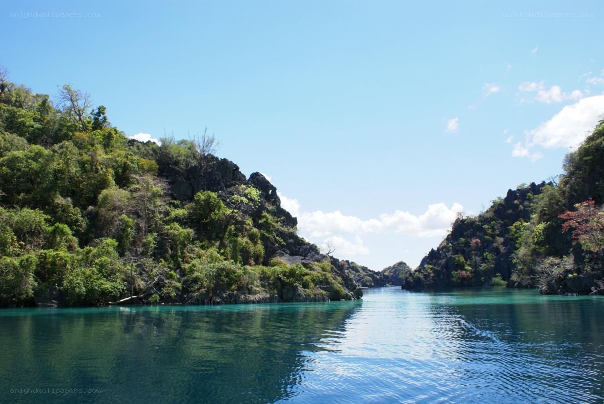 tropical bay with green cliffs