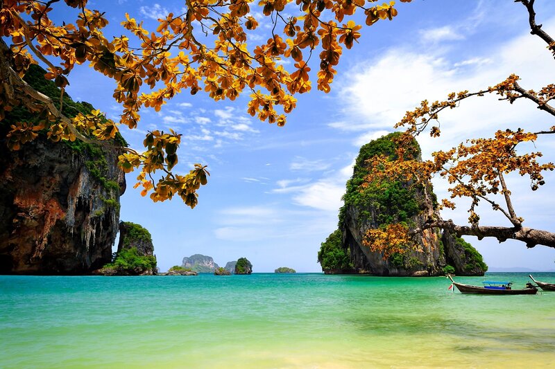 Tropical Bay with Limestone Cliffs — Blue, Serene, Afternoon, Photograph, Trees, Boat