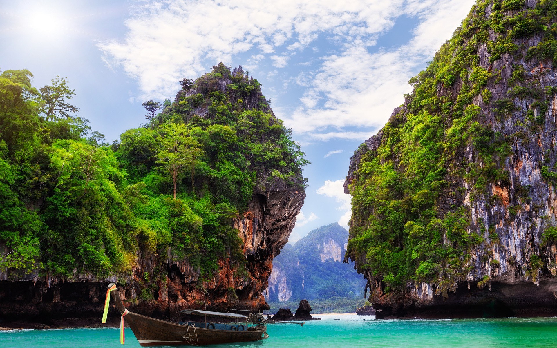 tropical bay with longtail boat