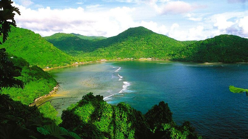 tropical bay with lush green hills