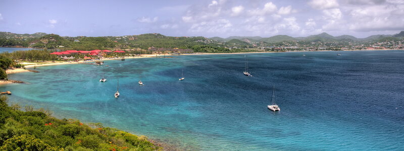 tropical bay with sailboats