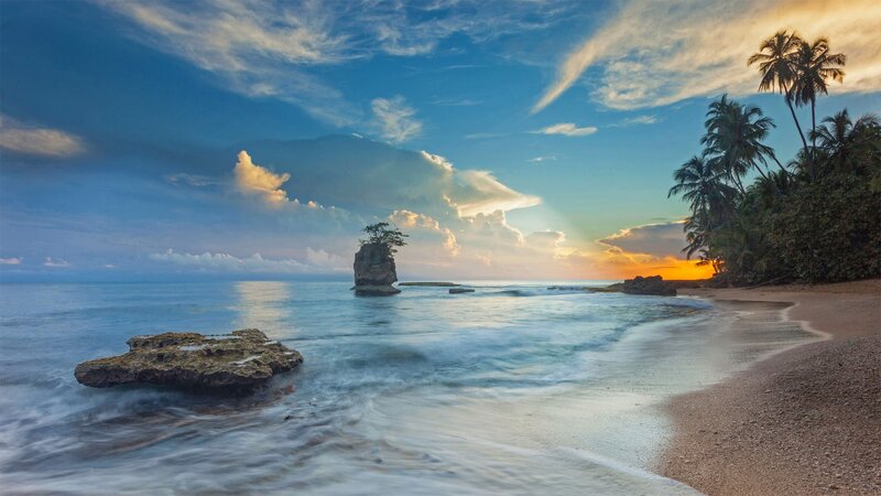 Tropical Beach at Sunset — Blue, Serene, Photograph, Palm Trees, Rock Formation