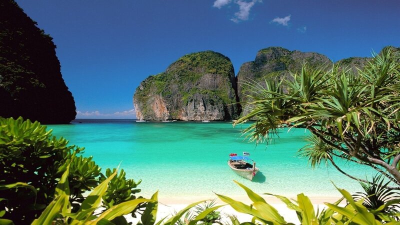 Tropical Beach Cove — Blue, Serene, Afternoon, Photograph, Boat, Cliffs, Palm Trees, Sand