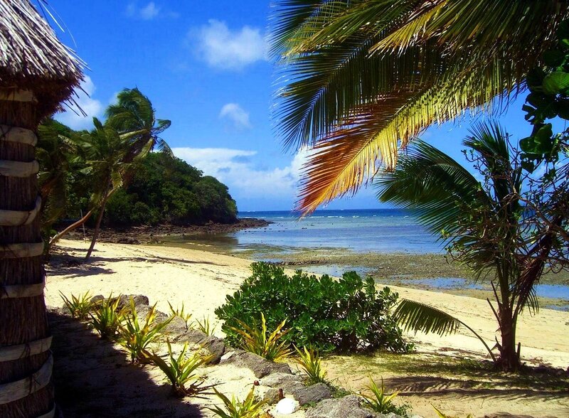 Tropical Beach Cove — Blue, Serene, Afternoon, Photograph, Palm Trees, Thatched Roof