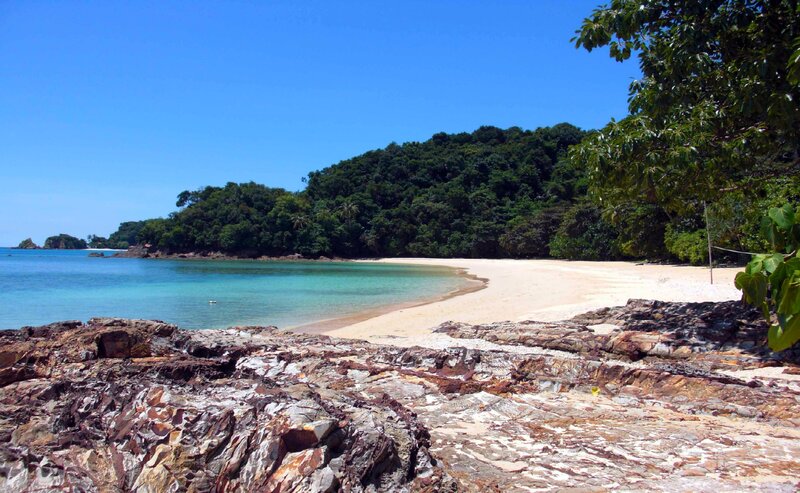 Tropical Beach Cove — Blue, Serene, Afternoon, Photograph, Sand, Trees, Rocks