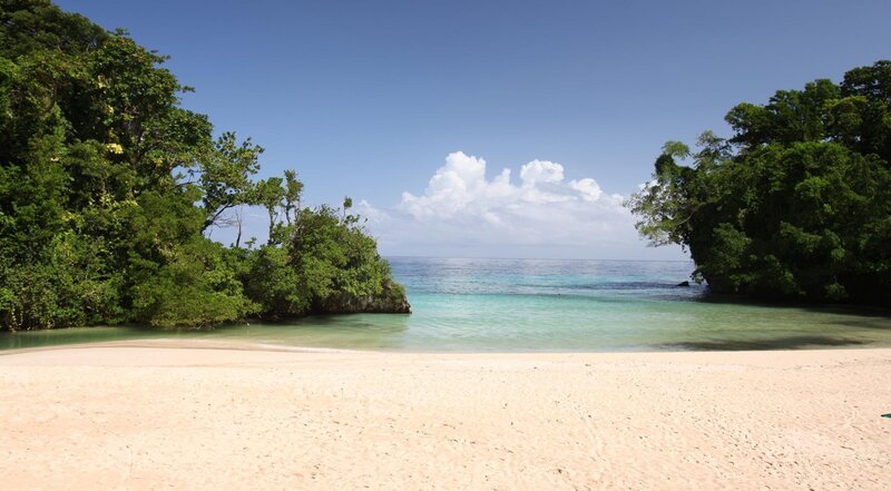 tropical beach cove with turquoise water