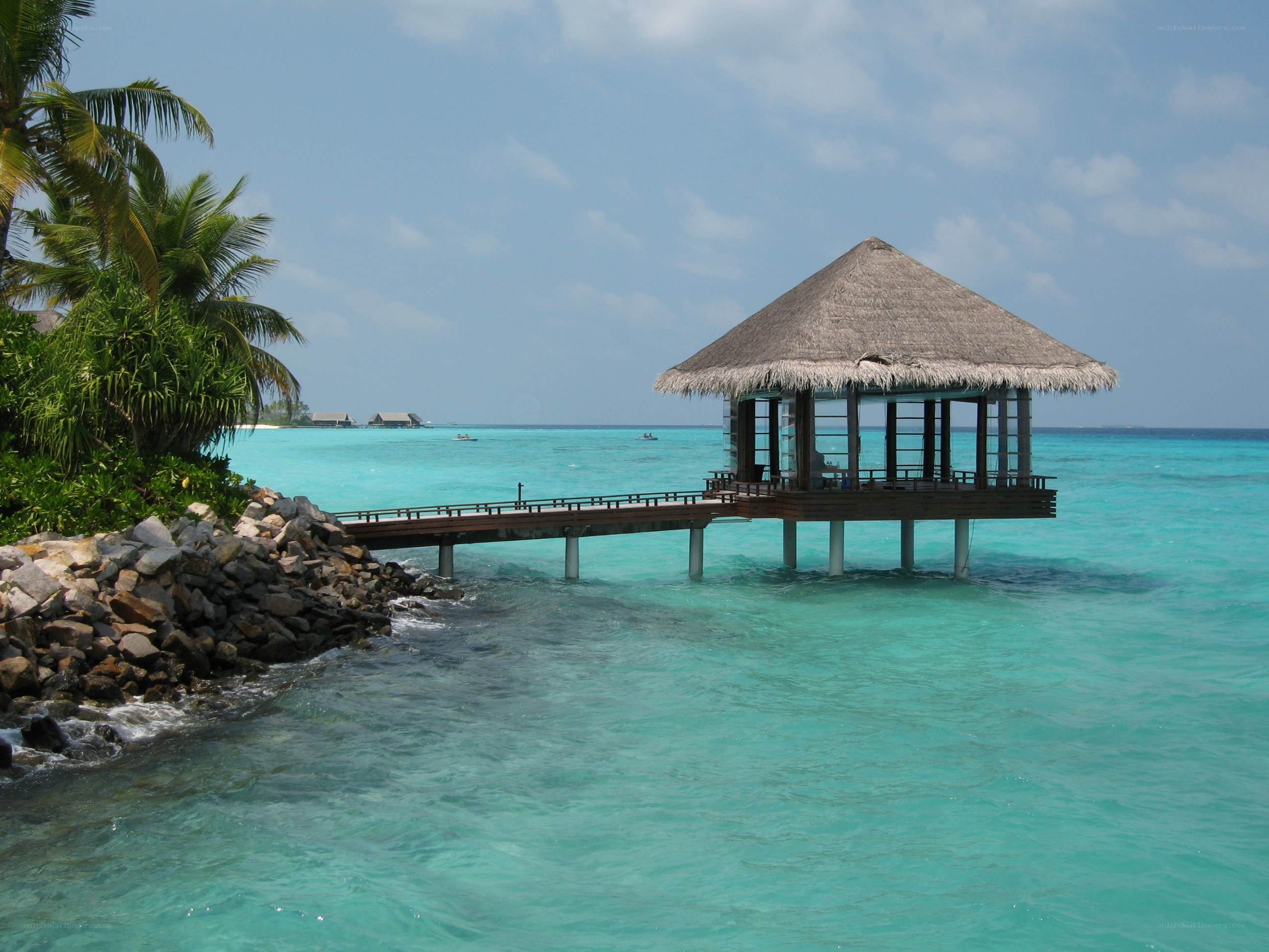 tropical beach hut over water