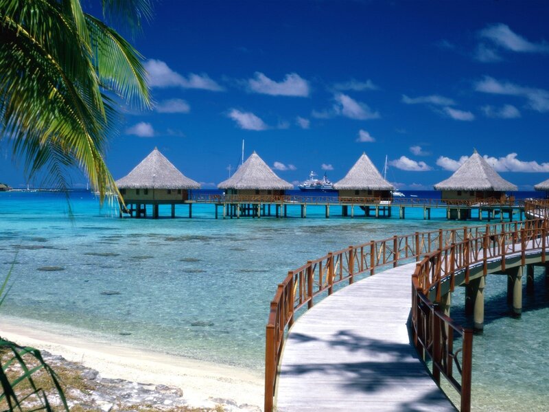 Tropical beach resort with overwater bungalows