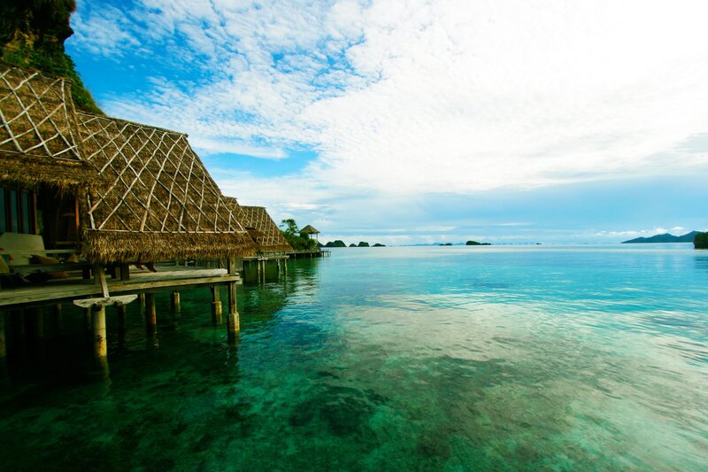 Tropical beach resort with overwater bungalows