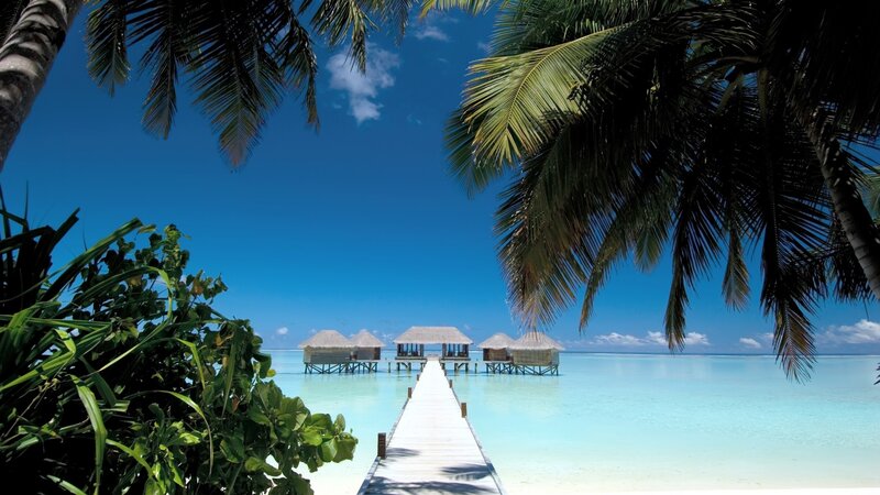 Tropical beach resort with overwater bungalows