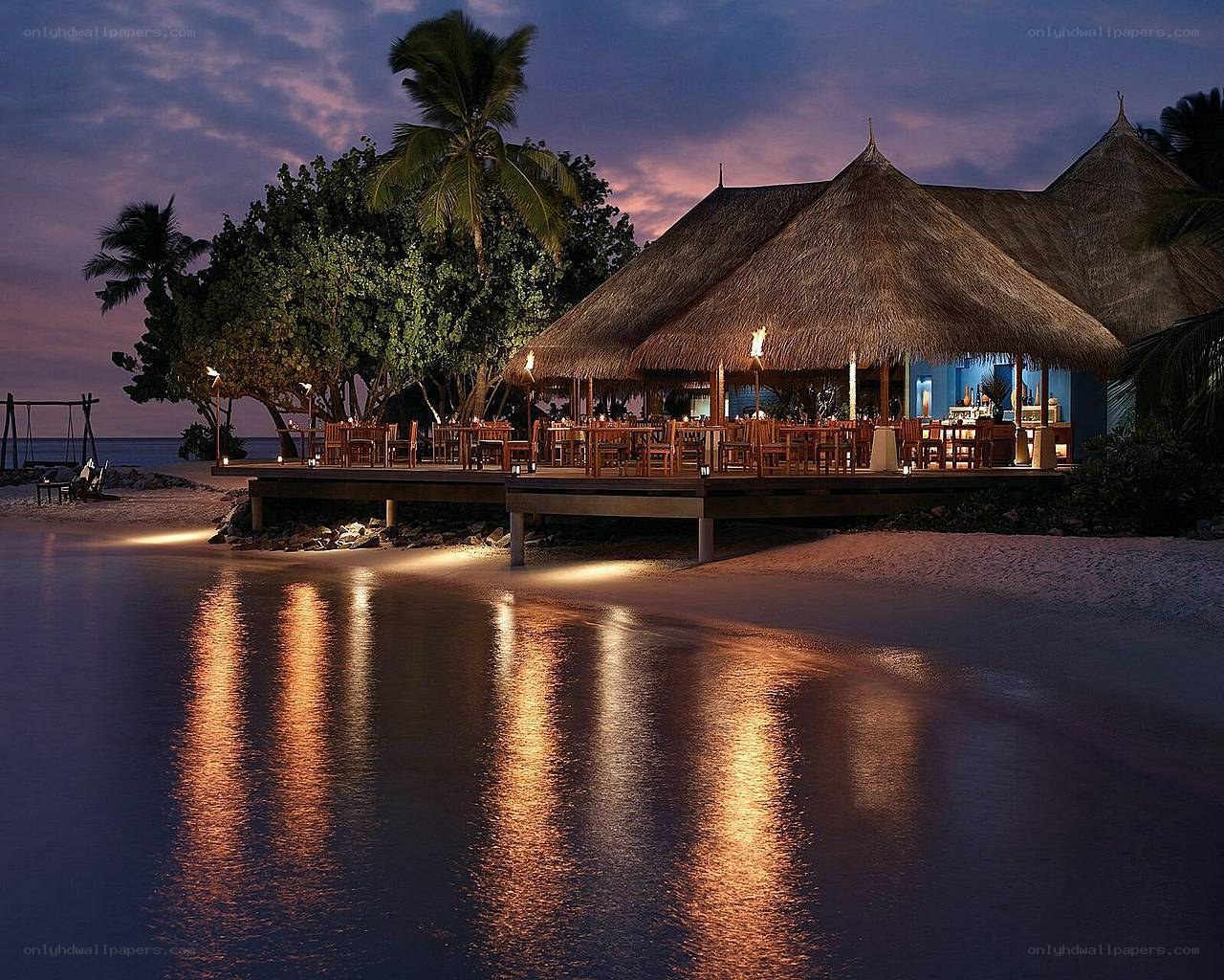 Tropical beach restaurant at dusk