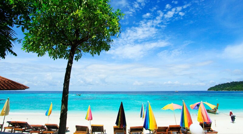 Tropical Beach Scene — Blue, Serene, Afternoon, Photograph, Umbrellas