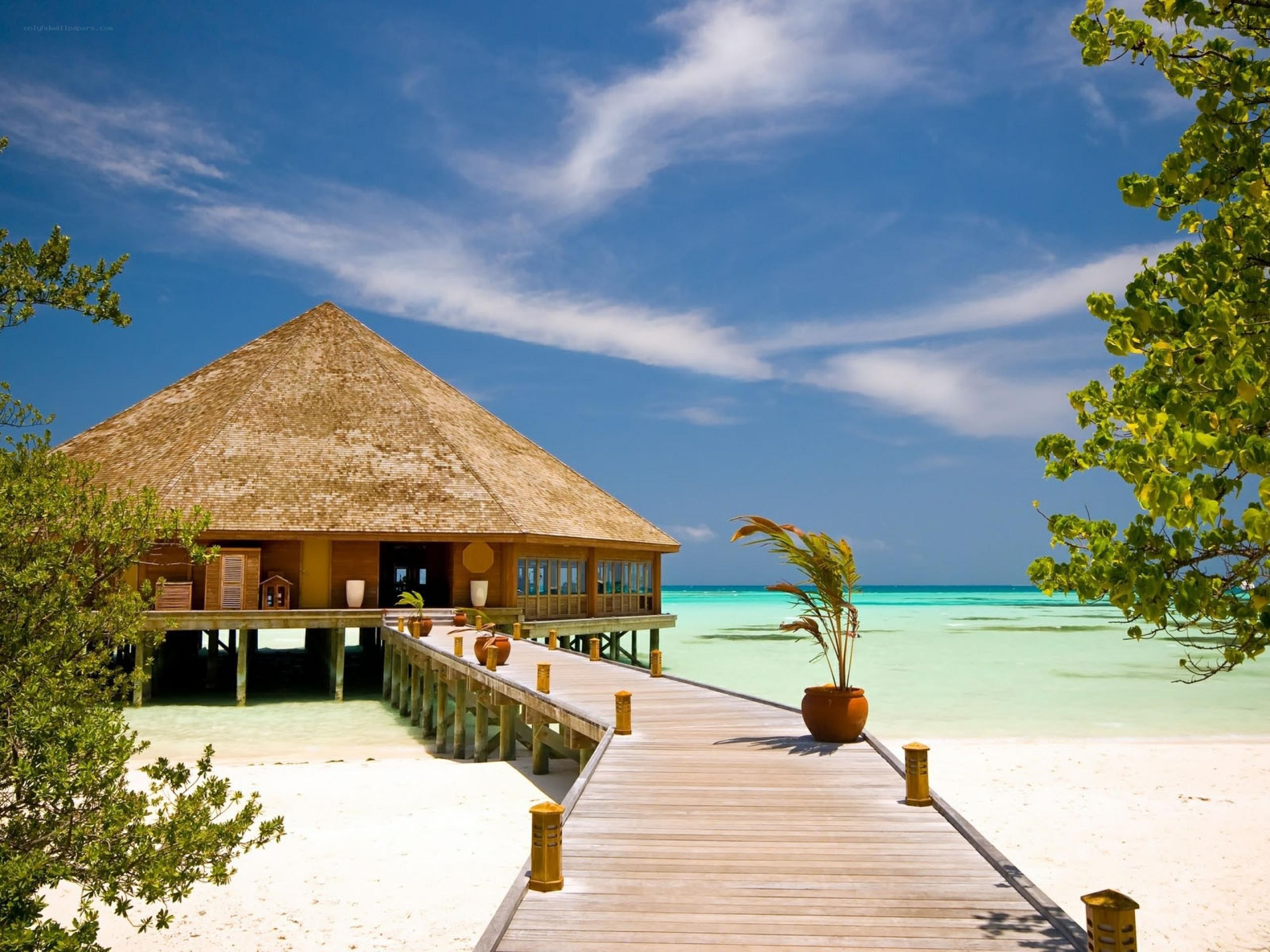 Tropical beach villa with pier